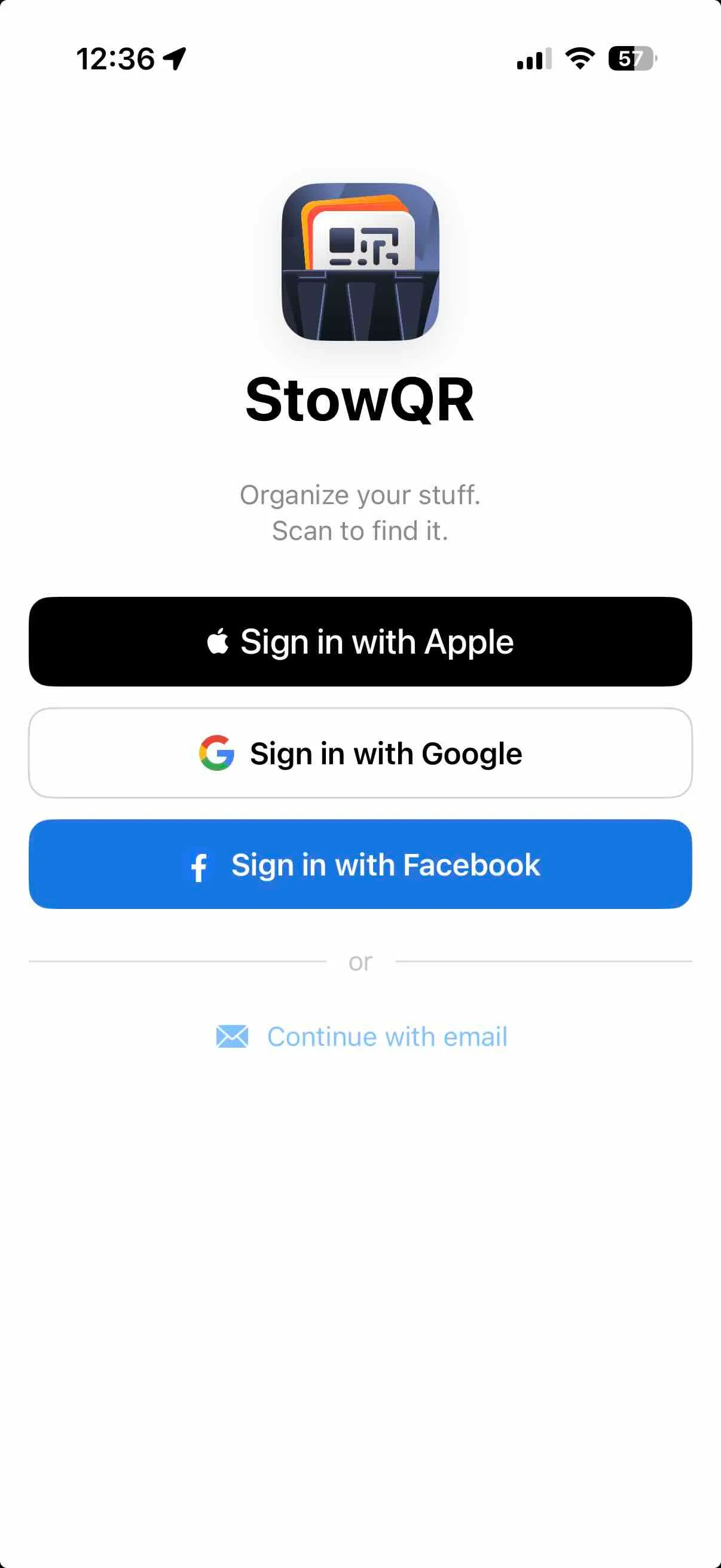 StowQR sign-in screen showing Apple, Google, and Facebook options